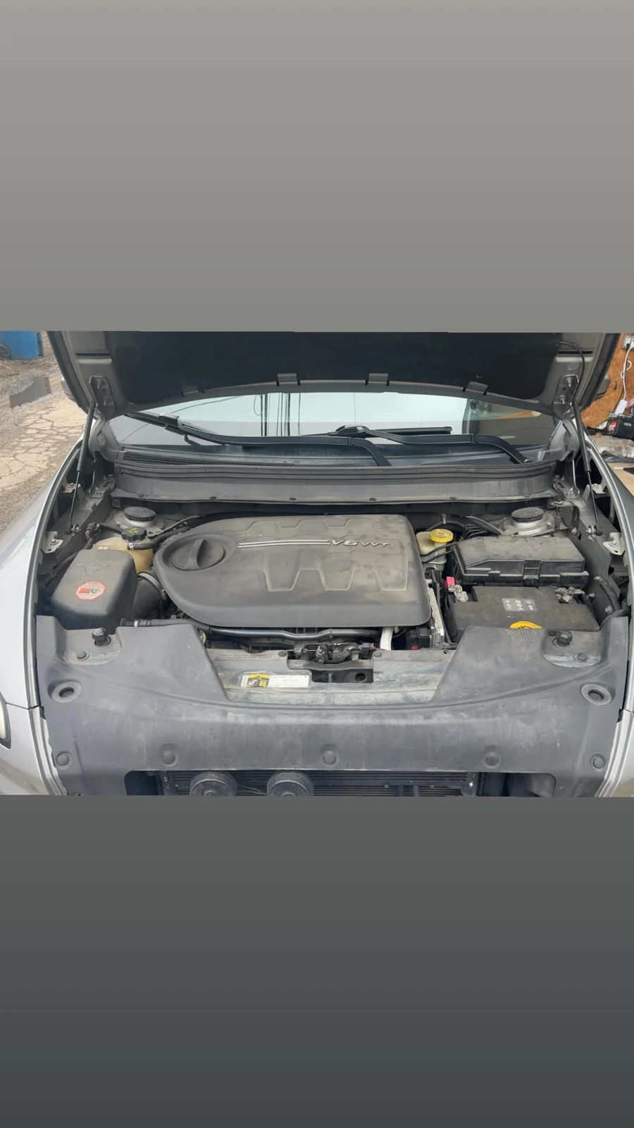 Dusty engine bay before cleanup