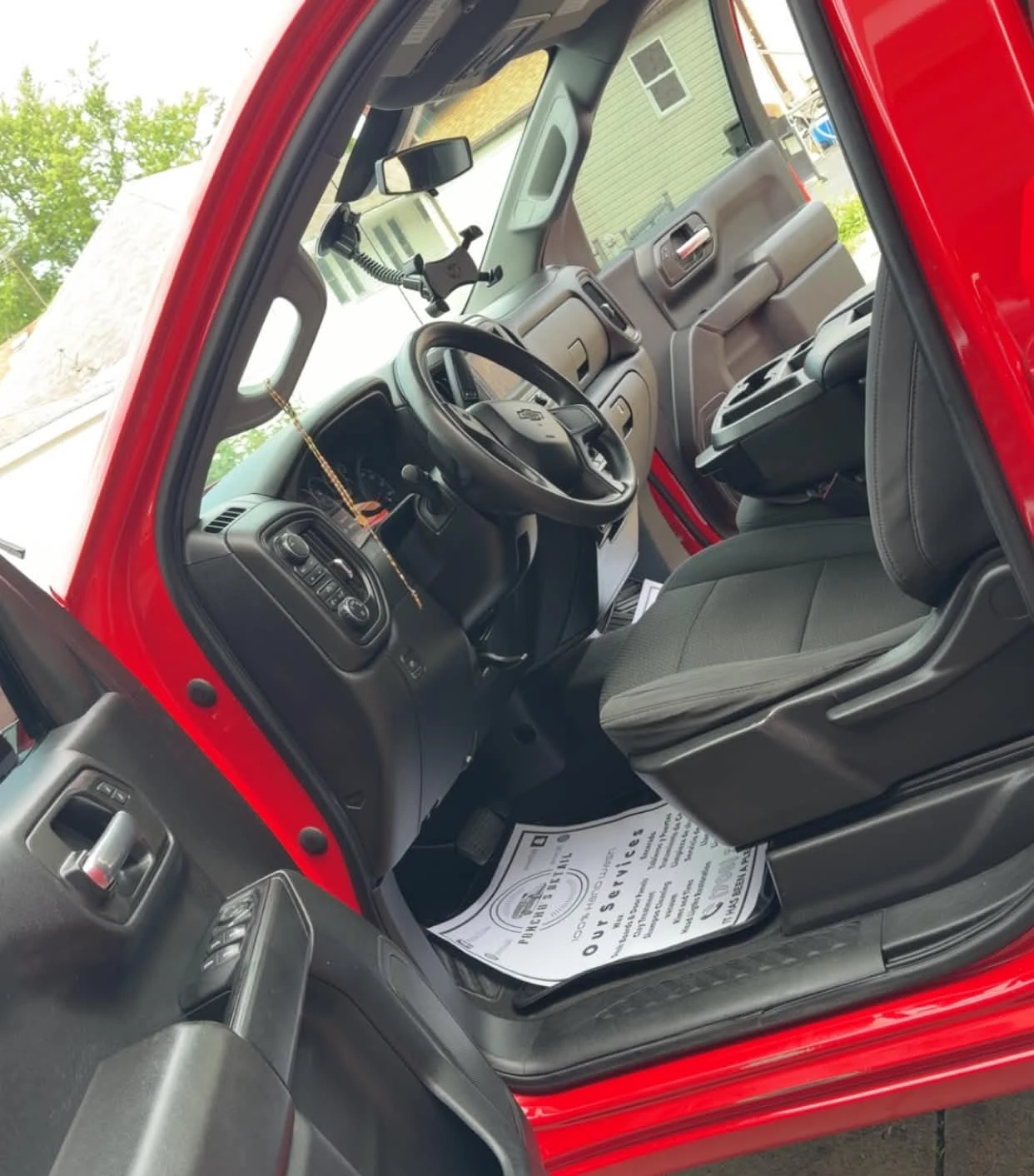 Clean red truck interior with detailed dashboard, front seat, and center console